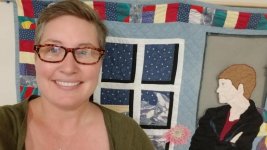 julie-crouse-hangs-the-quilt-in-her-truro-n-s-office.jpg