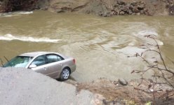 pontiac-sinkhole-flood-crash.jpg